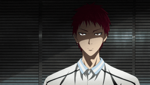a man with red hair is wearing a white shirt and a blue collar