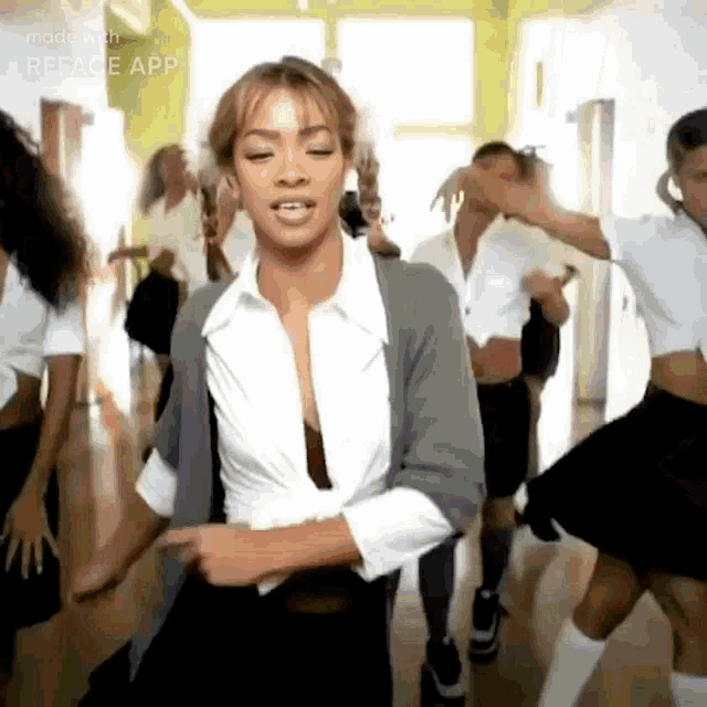 a group of people are dancing in a room with the words reface app on the bottom
