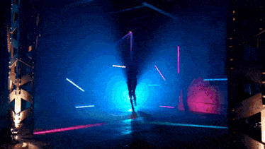 a dark room with purple and blue lights