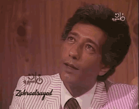 a close up of a man 's face with the name zahraelsayed on the bottom right