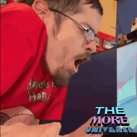 a man wearing glasses and a red shirt with the words the more universe on it