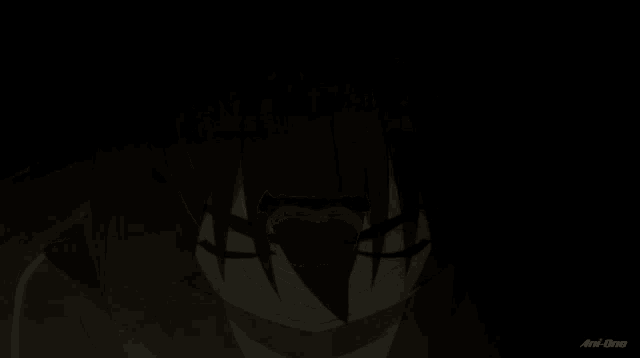 a close up of a person 's face with an anime logo in the lower right corner