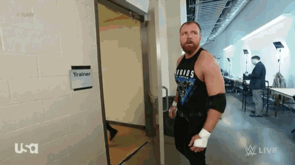 a man standing in front of a door labeled " trainer "