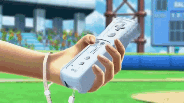 a person is holding a nintendo wii controller in their hands