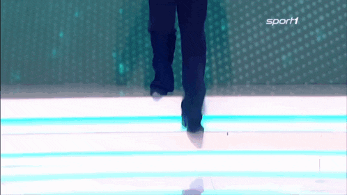 a person 's feet are shown on a screen with the word sport on it