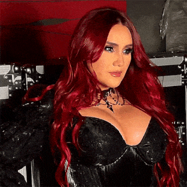 a woman with red hair wearing a black corset