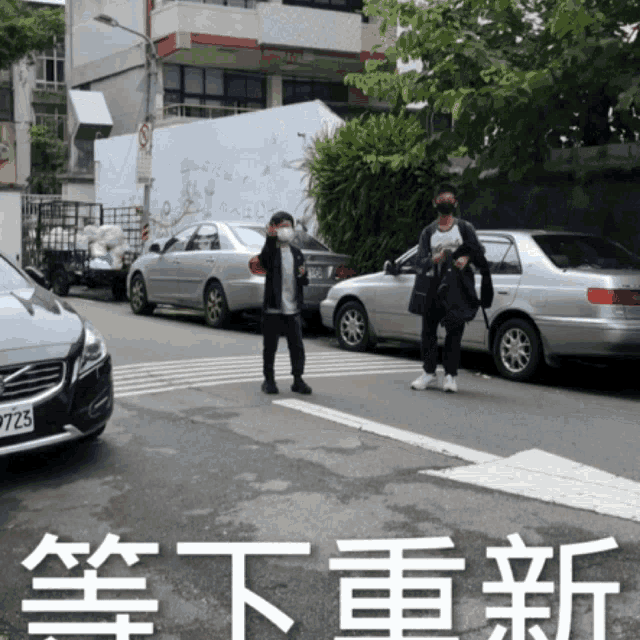 a man wearing a mask stands in front of a volvo car with license plate 9723