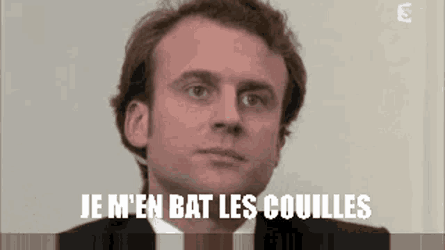 a close up of a man 's face with the words je m 'en bat les couilles below him