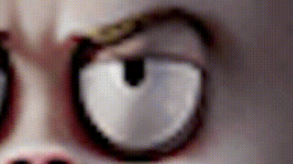 a close up of a person 's face with white eyes and a ring on their finger .