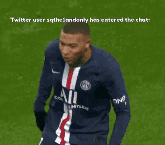 a soccer player is laying on the ground with his legs crossed .