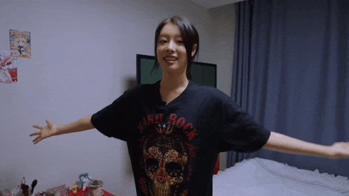 a woman wearing a black hard rock t-shirt