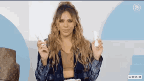 a woman in a plaid shirt is holding two bottles of lotion in front of a louis vuitton bag