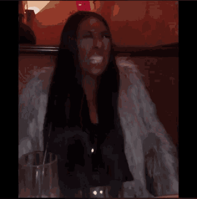 a blurry picture of a person 's face with a red spot