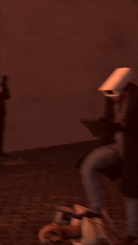 a man with a camera on his head standing next to a newspaper