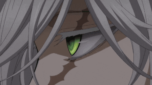 a closeup of a person 's eye with a green pupil