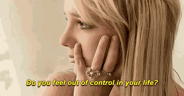 a woman with a ring on her finger is talking on a cell phone and asking do you feel out of control in your life .