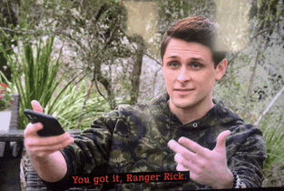 a man holding a cell phone with the words you got it ranger rick on the screen