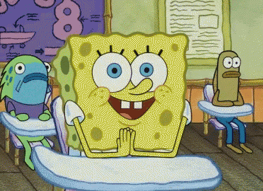 a cartoon of spongebob sitting at a desk