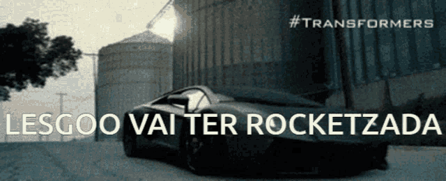 a transformers poster with a car in the foreground