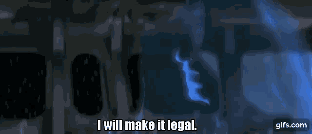 a man is smoking a cigarette in a dark room and saying `` i will make it legal '' .
