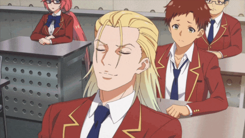 a man with long blonde hair is sitting in a classroom with other students