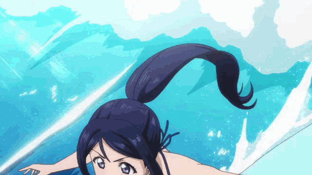 a girl with a ponytail is diving into the ocean