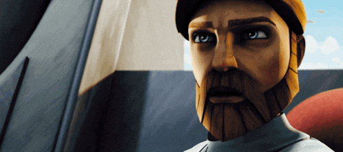 a man with a beard and a hat looks at the camera