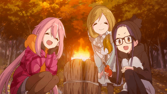 three anime girls are sitting around a campfire in the woods