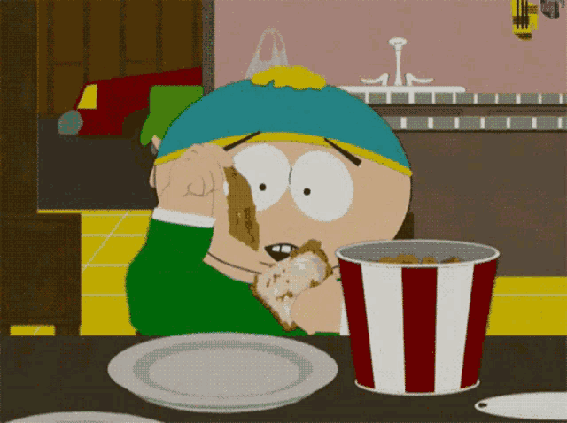 a cartoon character from south park is eating a piece of chicken next to a bucket of kfc