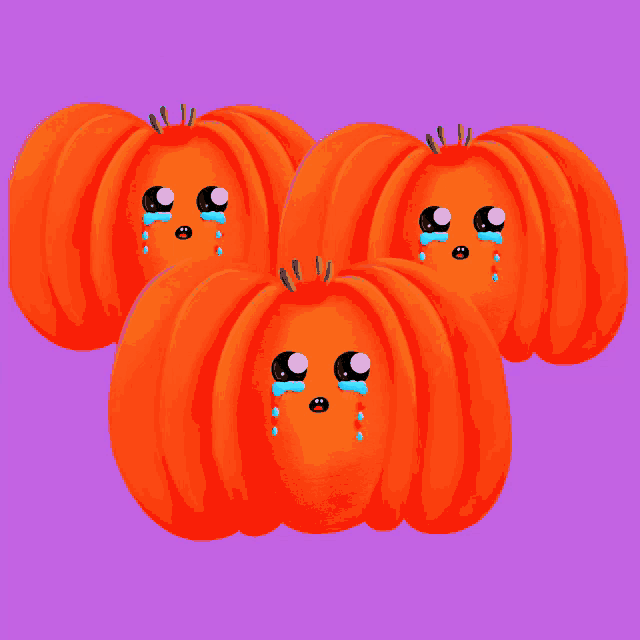 a group of pumpkins with crying faces are swimming in the water