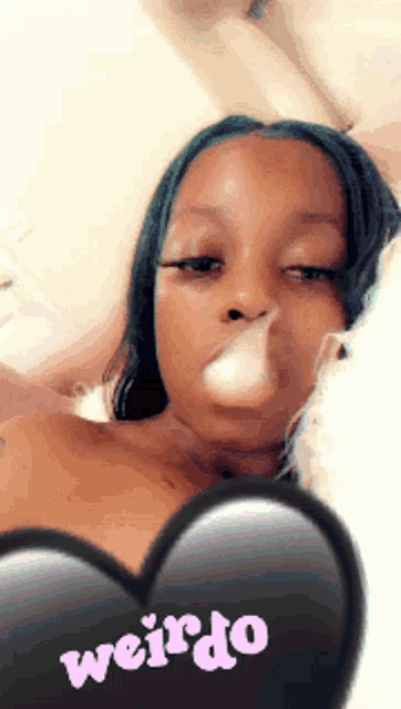 a woman smoking a cigarette with the words weirdo written on the bottom