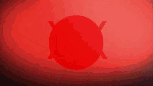 a red circle in the middle of a blue and red background
