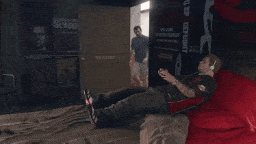 a man playing a video game with a screen that says swine hoard pig kills 990