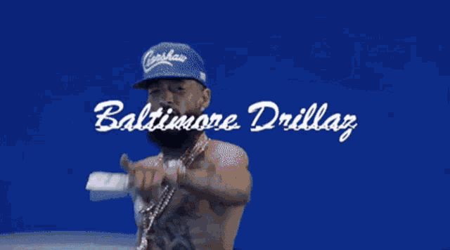 a man sitting on the back of a white car with the words baltimore drillaz written on it