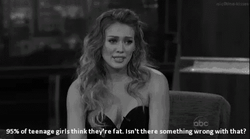 a black and white photo of a woman with the caption 95 % of teenage girls think they are fat