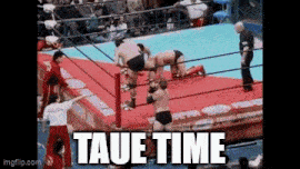 a group of men are wrestling in a ring with the words taue time written on the bottom .