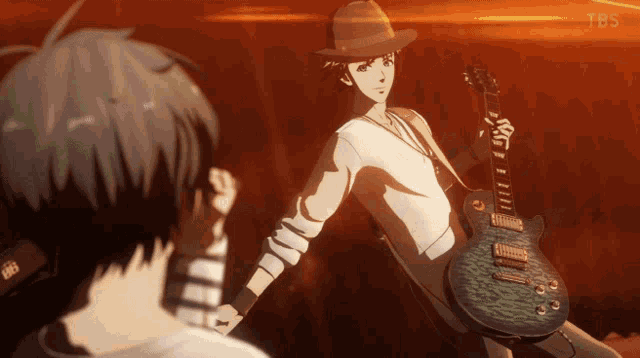 a man in a hat holds a guitar in front of another man
