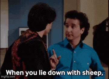 two men are standing next to each other and one of them is saying when you lie down with sheep .