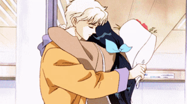 a man is hugging a woman who is holding a bouquet of roses