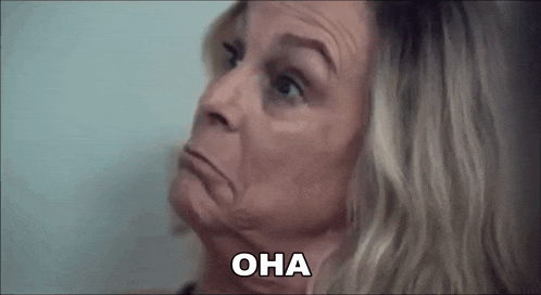 a close up of a woman making a funny face with the word oha written next to her .