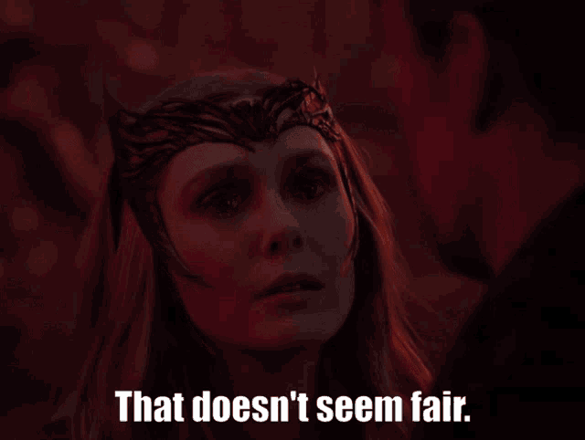 a woman with a crown on her head says that does n't seem fair next to a man