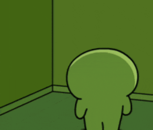 a green cartoon character is standing in the corner of a room .
