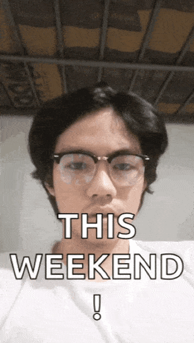 a man wearing glasses says " this weekend " in front of his face