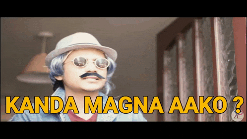 a man wearing a hat and sunglasses with the words kanda magna aako
