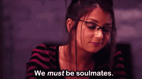 a girl wearing glasses says we must be soulmates