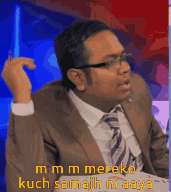 a man in a suit and tie says ' mmmm mereko kuch samajh ni aaya ' in yellow letters