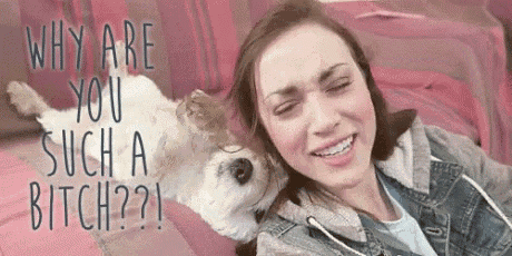 a woman is laying on a couch with a dog and a caption that says `` why are you such a bitch ''