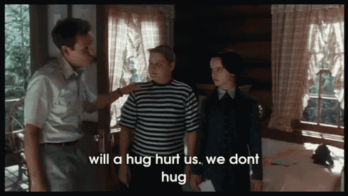 a group of people standing next to each other with the words " will a hug hurt us we dont hug " at the bottom