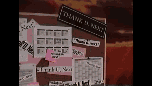 a bulletin board has a sign that says thank u. next