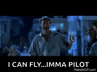 a man in a blue shirt is standing in front of a crowd and says `` i can fly .. imma pilot '' .
